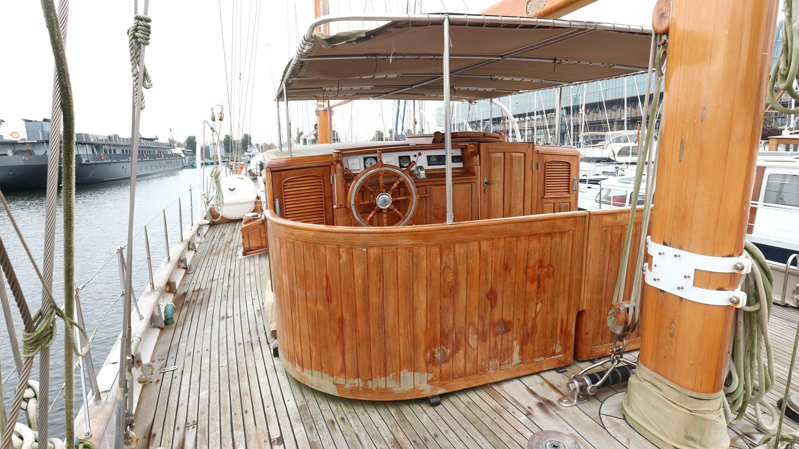 a wooden boat on a dock aboard ARIES Yacht for Sale