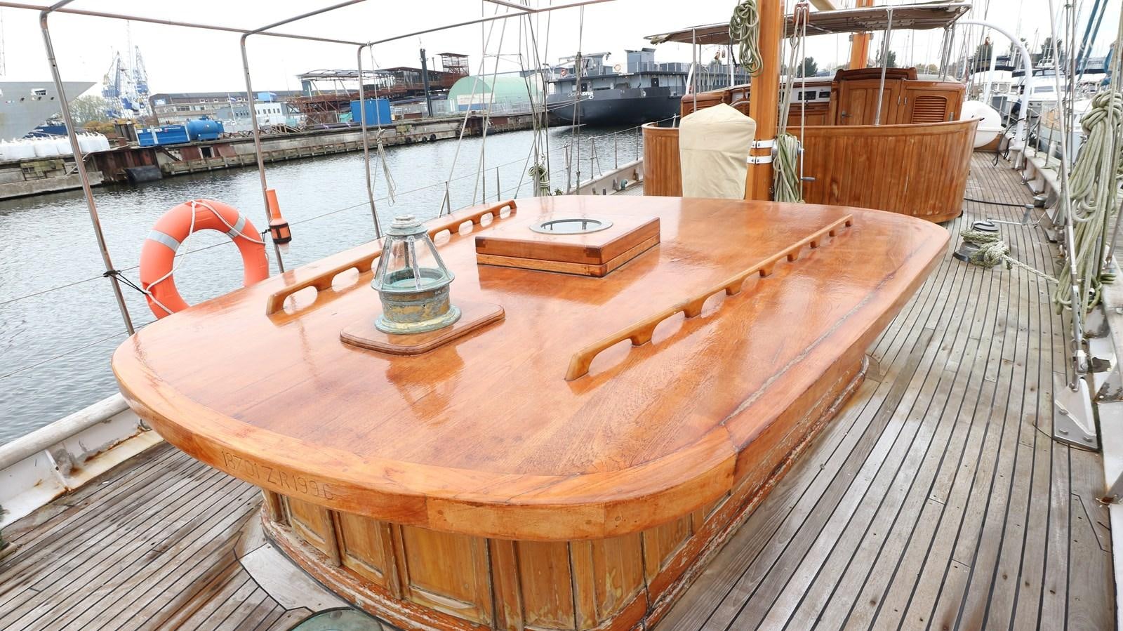 a wooden boat on a dock aboard ARIES Yacht for Sale