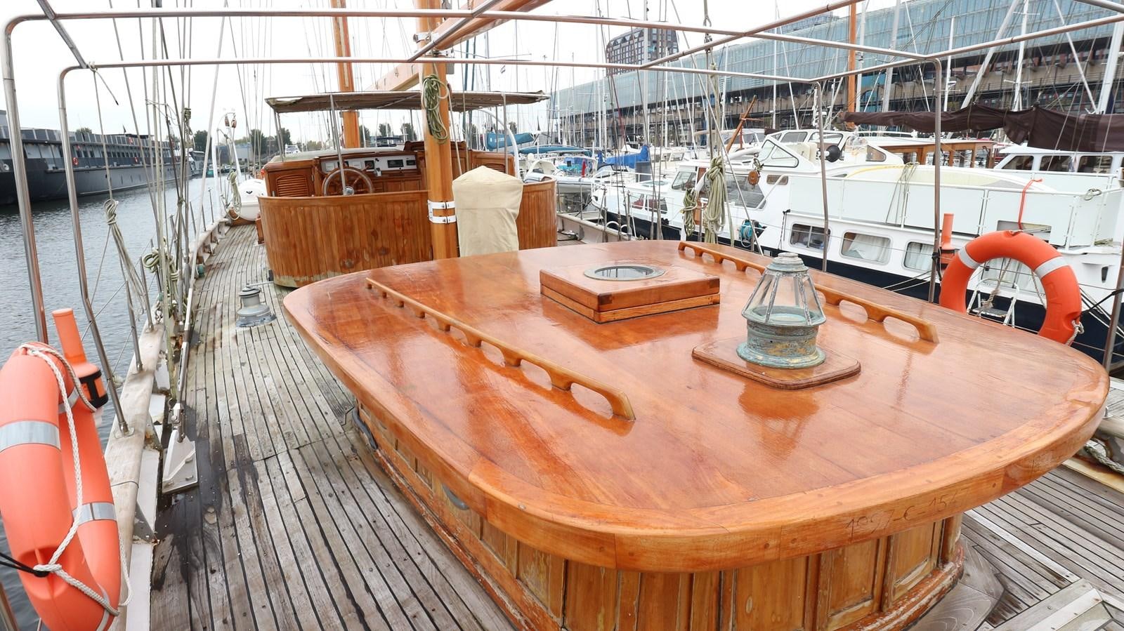 a wooden boat on a dock aboard ARIES Yacht for Sale