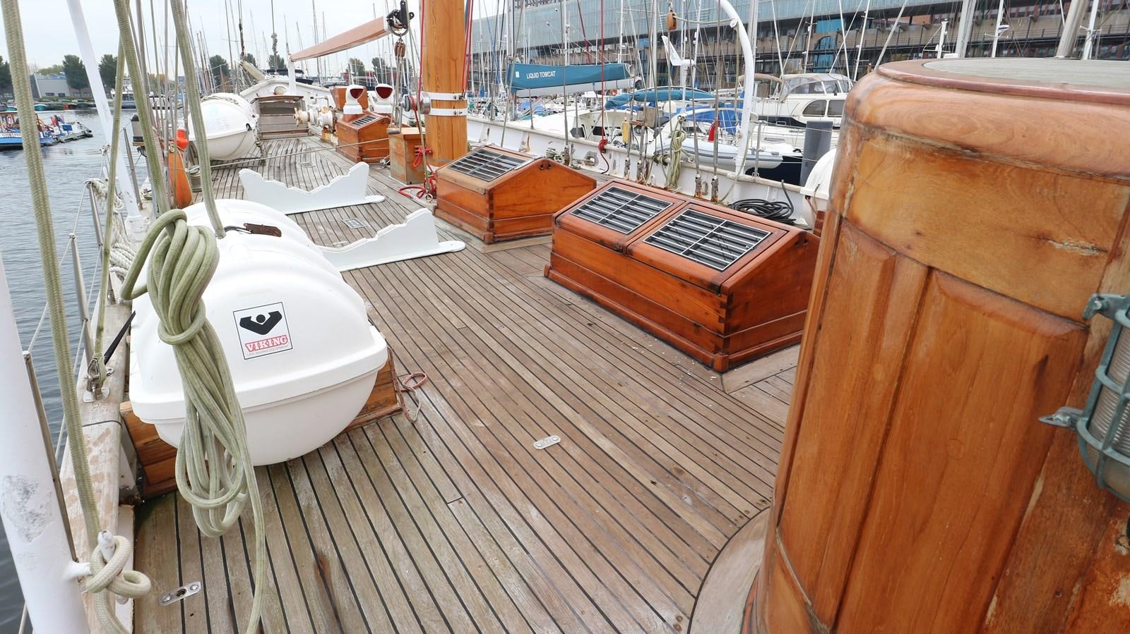 a boat dock with boats aboard ARIES Yacht for Sale
