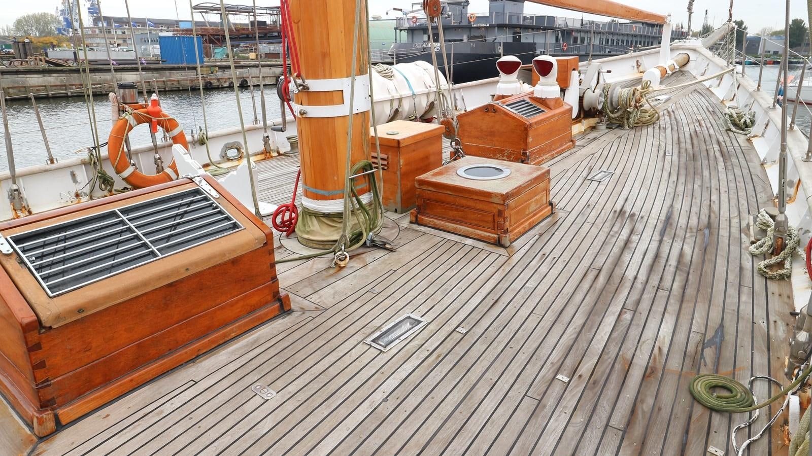 a deck with a deck and a boat on it aboard ARIES Yacht for Sale
