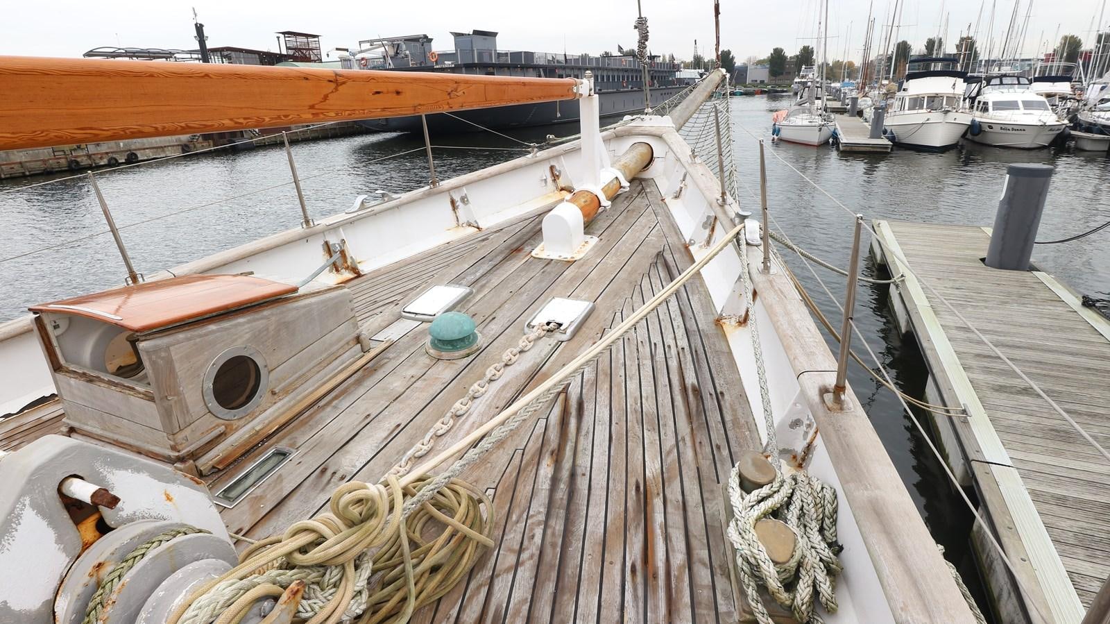 a boat docked at a pier aboard ARIES Yacht for Sale