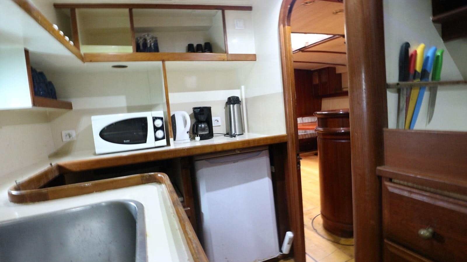 a kitchen with a sink and a stove aboard ARIES Yacht for Sale