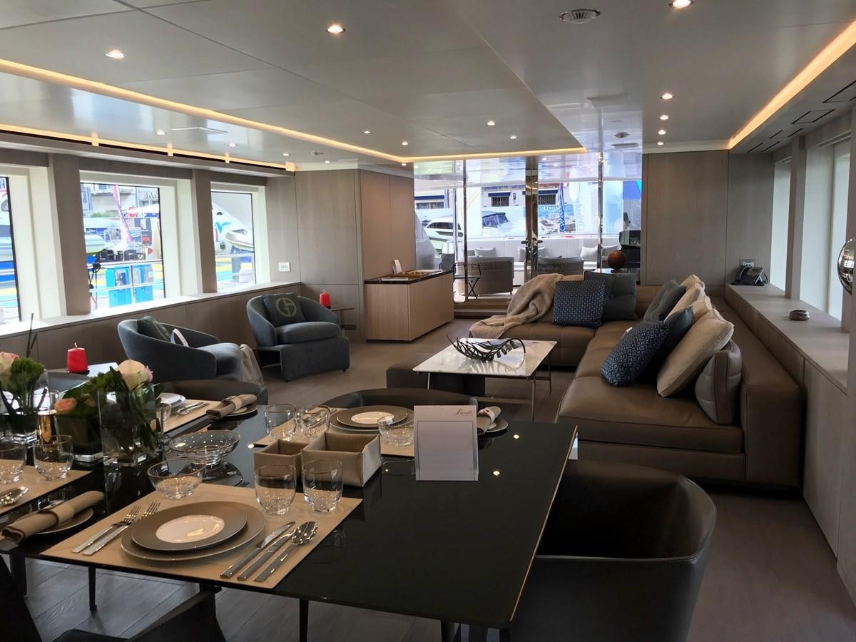 a living room with a large table and couches aboard ALEGRE Yacht for Sale