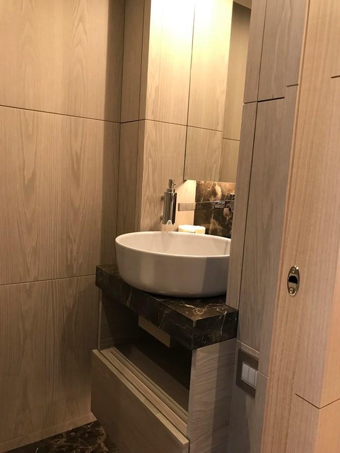 a bathroom with a sink and a mirror aboard ALEGRE Yacht for Sale