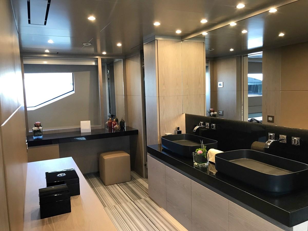 a modern bathroom with sinks and a large mirror aboard ALEGRE Yacht for Sale