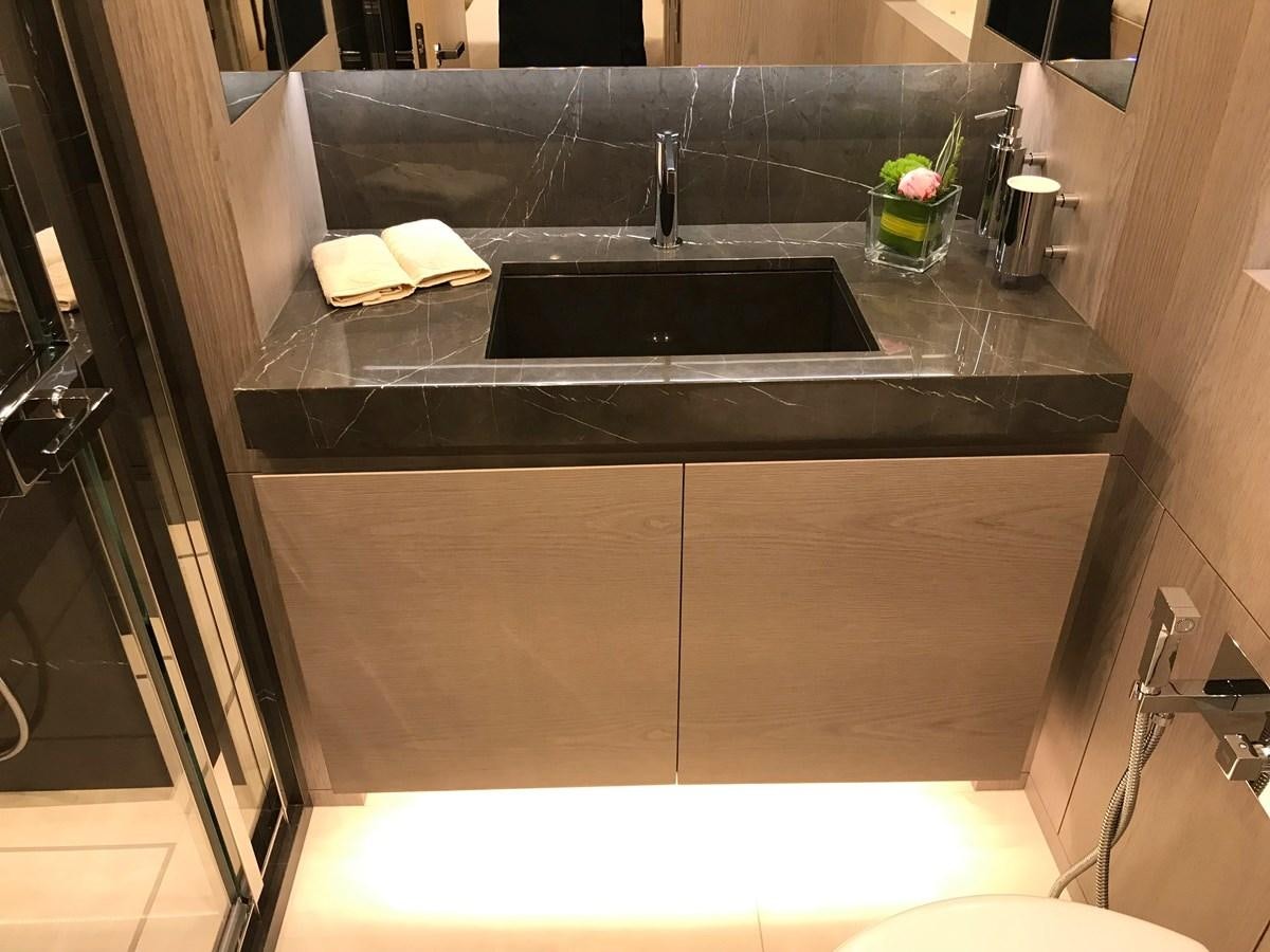 a kitchen with a black countertop aboard ALEGRE Yacht for Sale