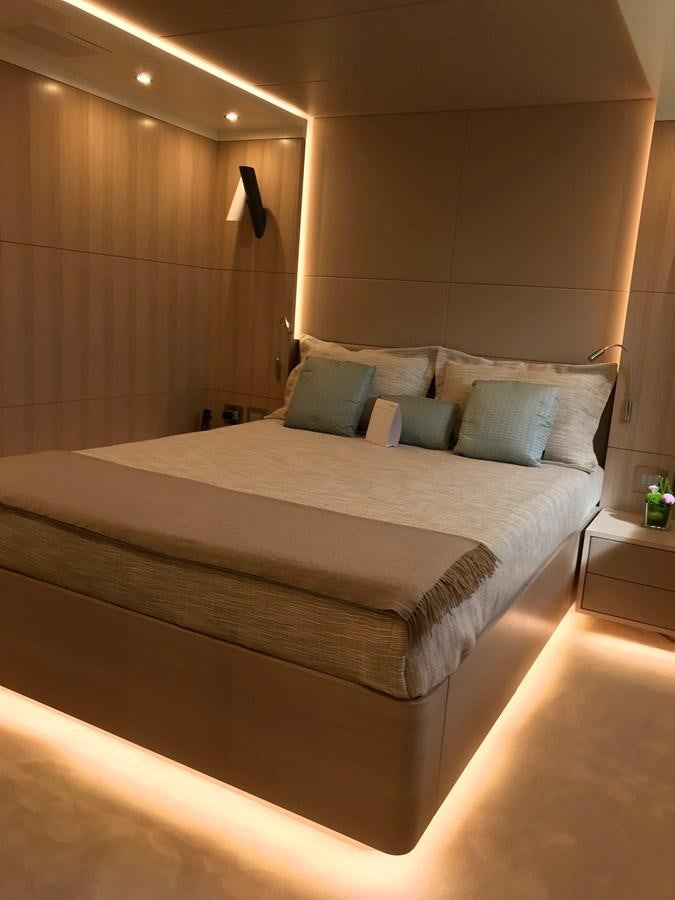 a bed with a white sheet and pillows aboard ALEGRE Yacht for Sale