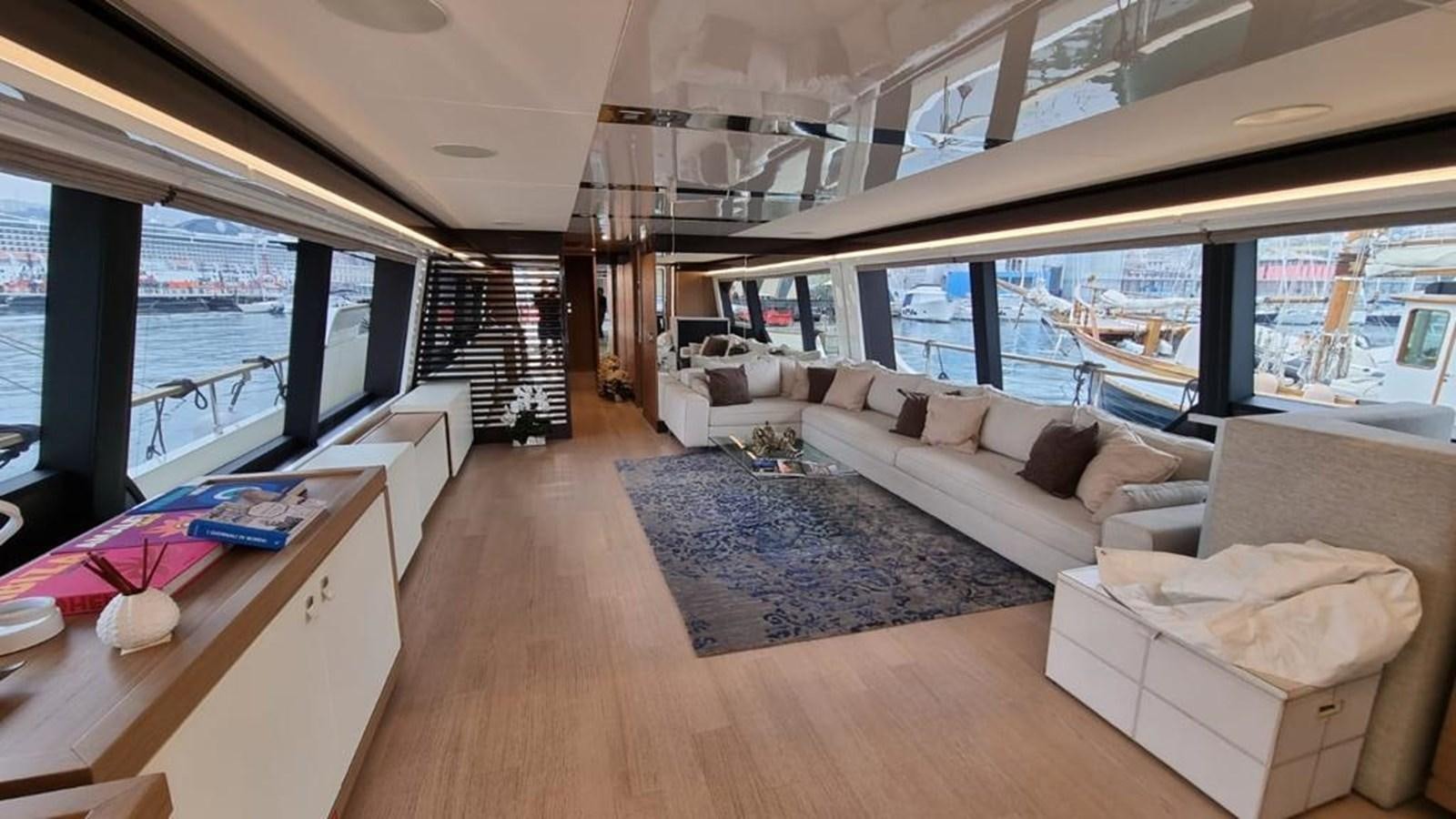 a living room with a large window aboard MERIDIANA Yacht for Sale