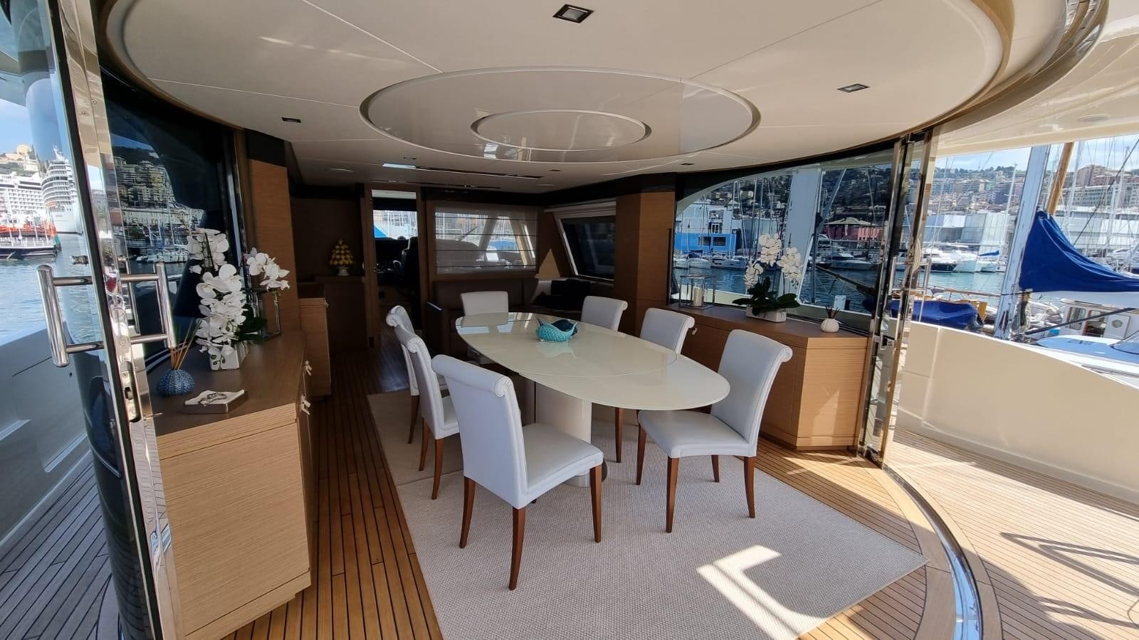 a room with a table and chairs aboard MERIDIANA Yacht for Sale