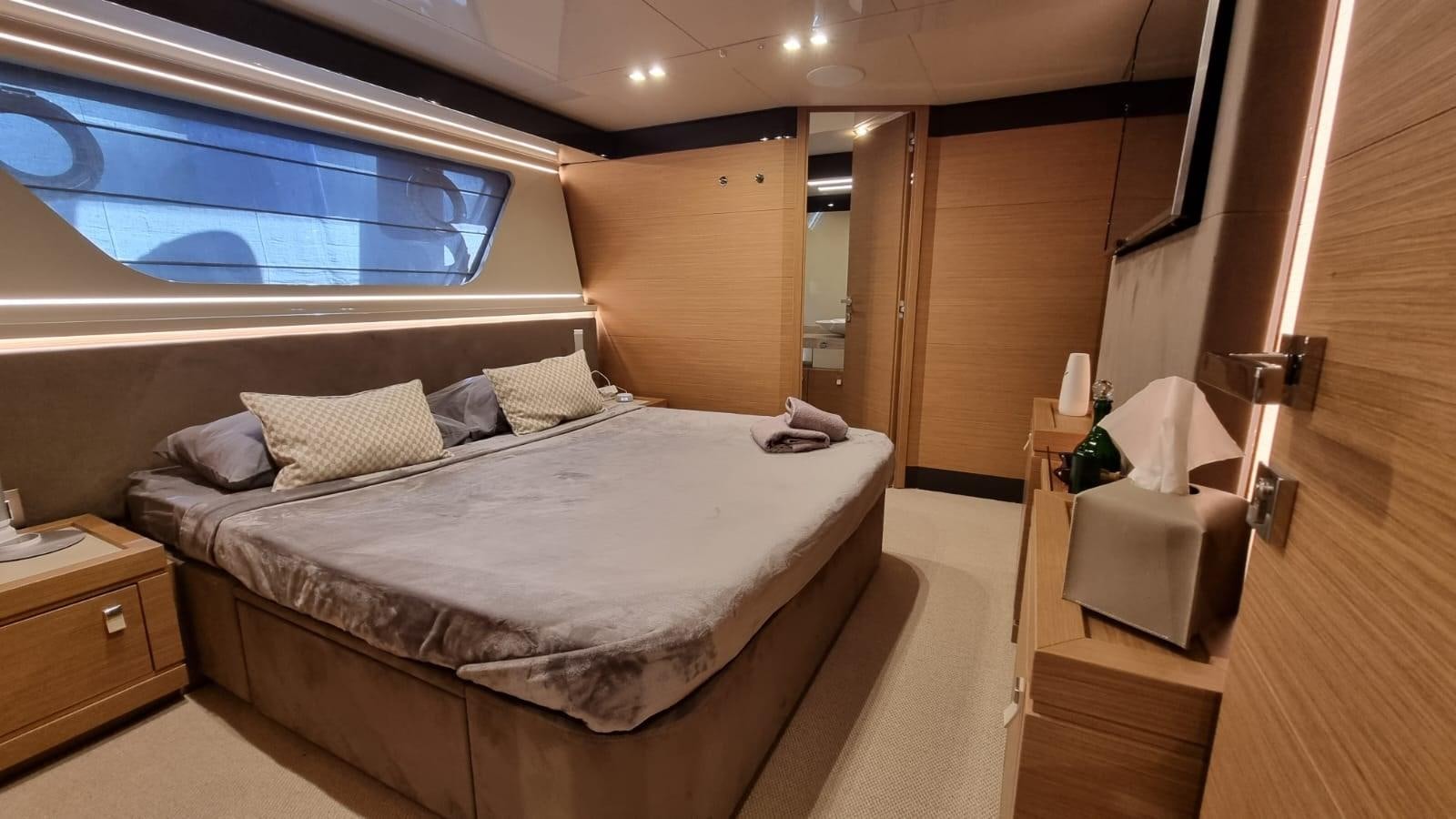 a bed in a room aboard MERIDIANA Yacht for Sale