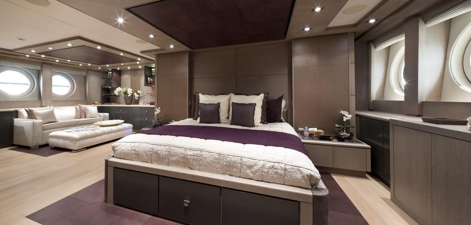 a large bedroom with a bed aboard DEFIANT Yacht for Sale