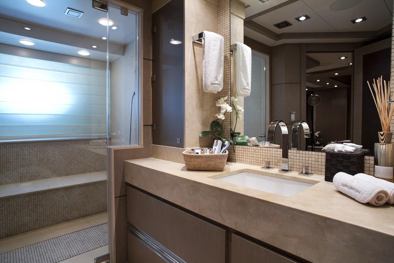 a bathroom with a large mirror aboard DEFIANT Yacht for Sale