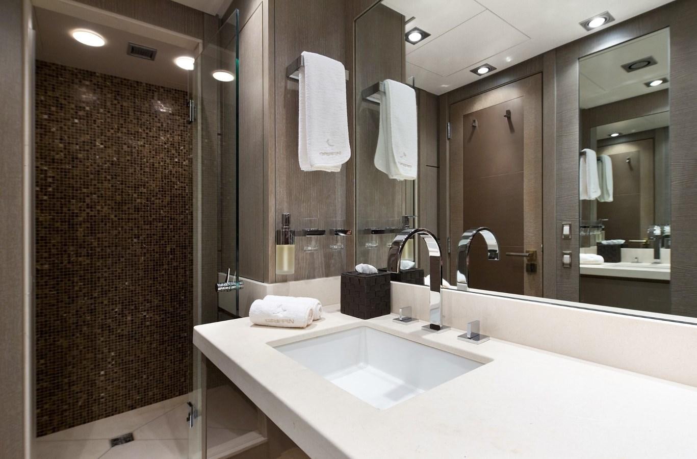 a bathroom with a large mirror aboard DEFIANT Yacht for Sale