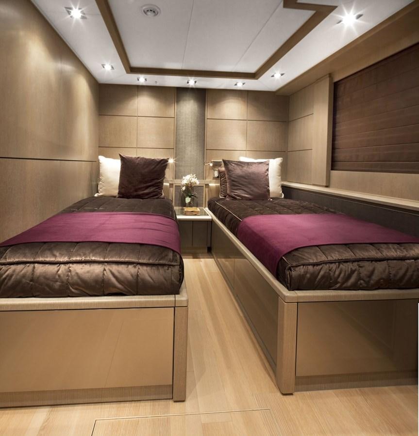 a couple of beds in a hotel room aboard DEFIANT Yacht for Sale