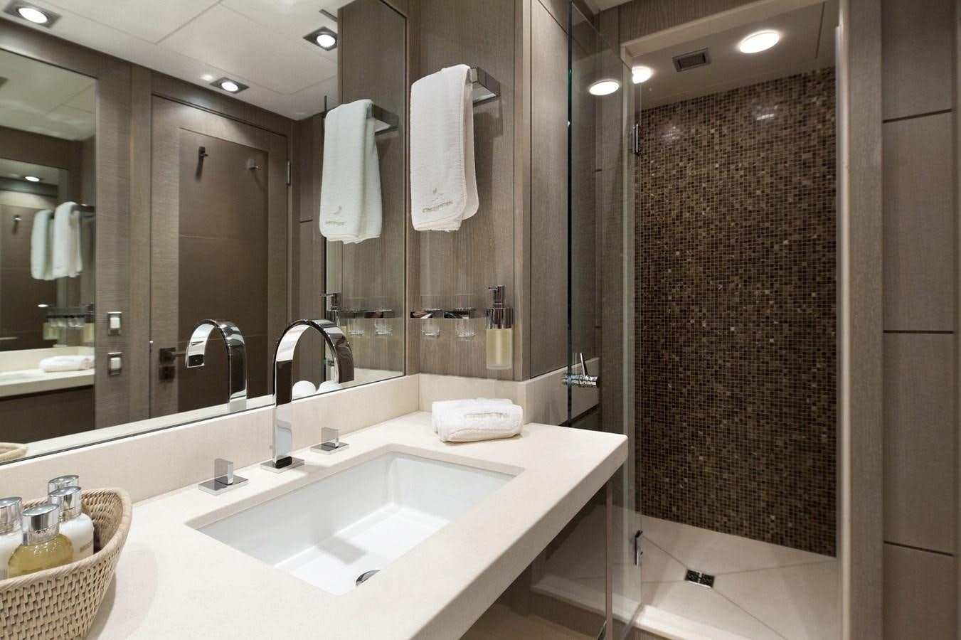 a bathroom with a large mirror aboard DEFIANT Yacht for Sale