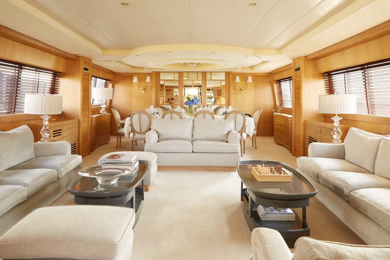 a living room with a large window aboard SEA LADY II Yacht for Sale