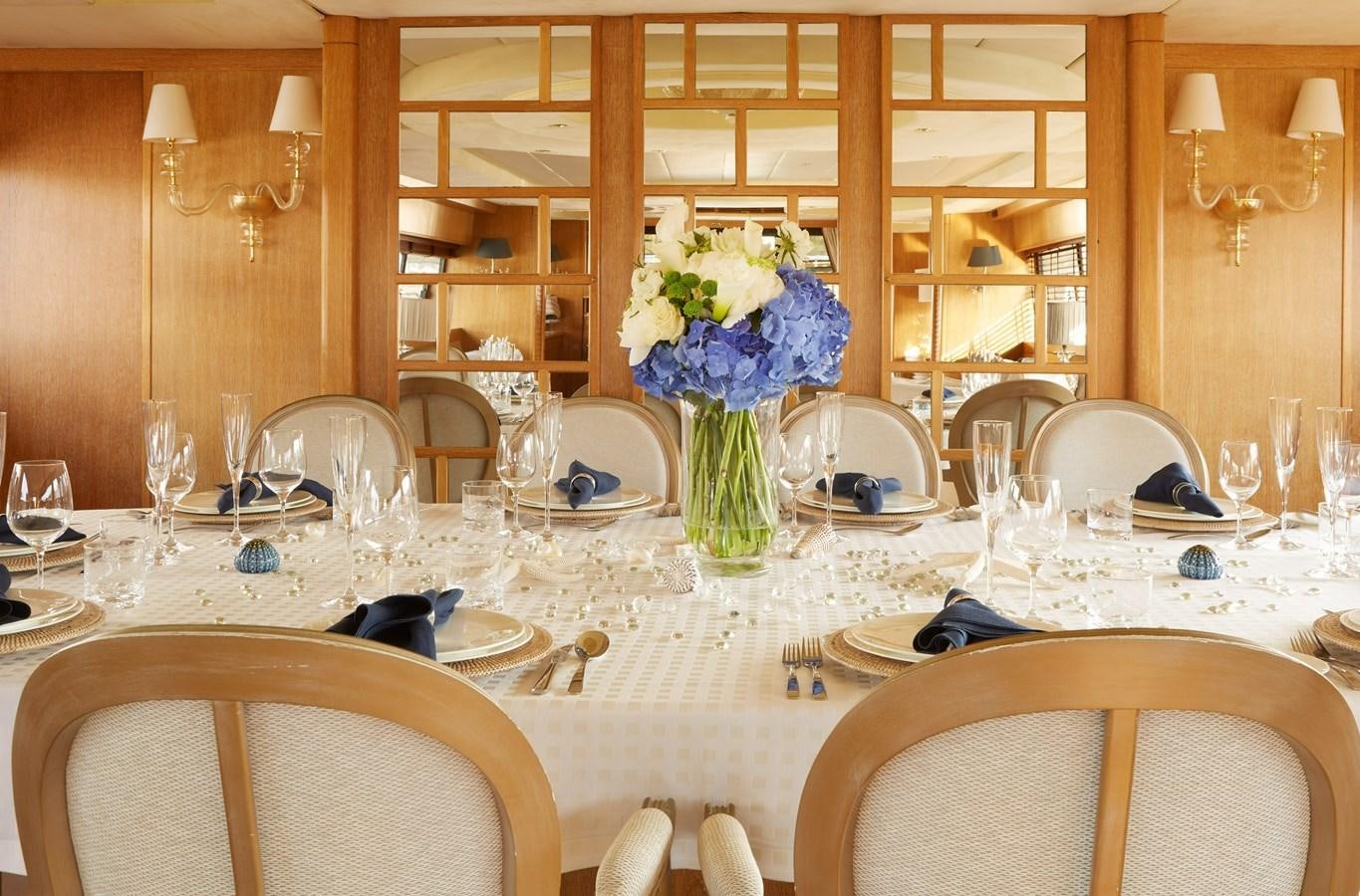 a table set for a formal dinner aboard SEA LADY II Yacht for Sale