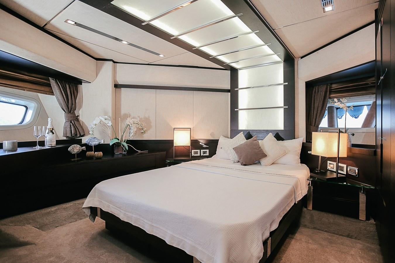 a large bedroom with a large bed aboard PATRONESS Yacht for Sale