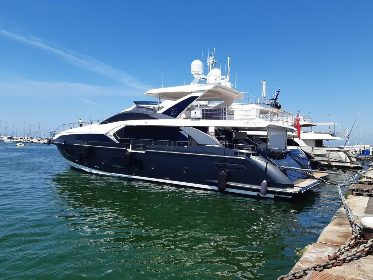 a large white boat in the water aboard QUEEN ANA Yacht for Sale