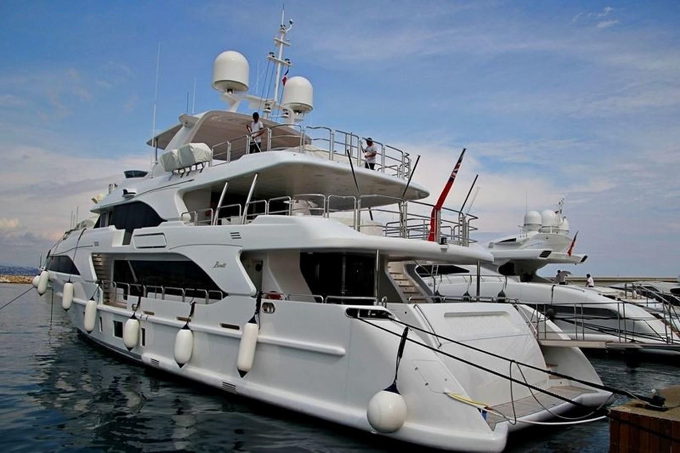 a boat docked at a pier aboard CLASSIC 121 Yacht for Sale