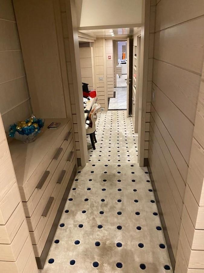 a hallway with a person standing in the middle of it aboard CLASSIC 121 Yacht for Sale