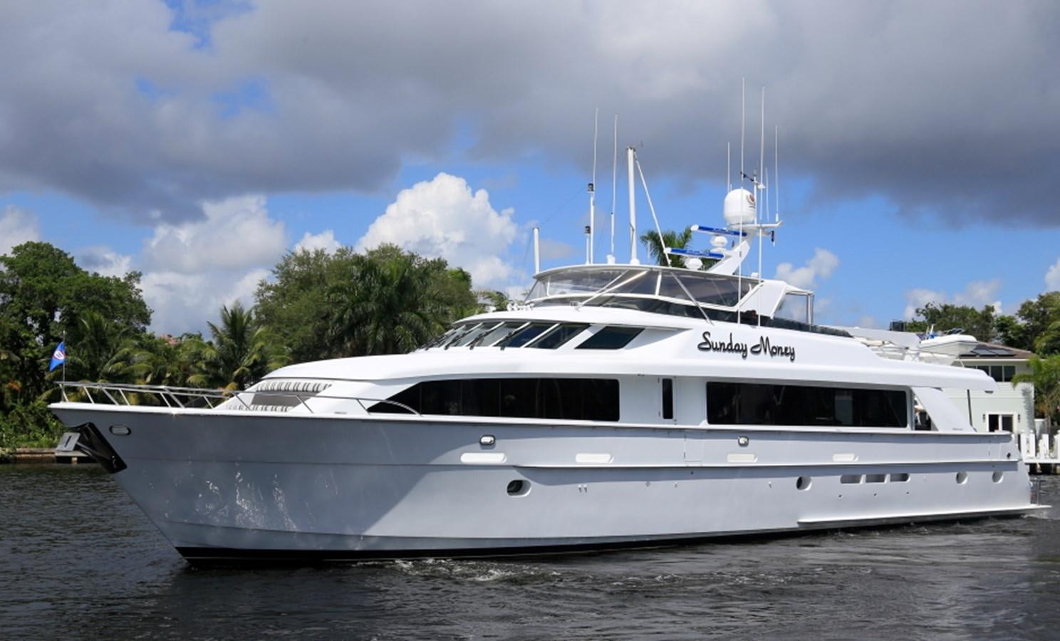 a white yacht on the water aboard SUNDAY MONEY Yacht for Sale