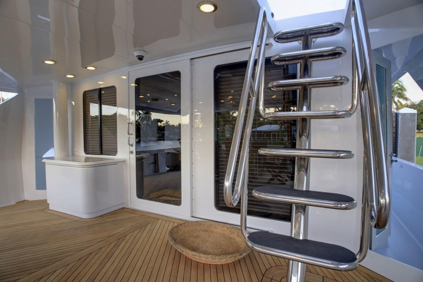 a large glass door with a ladder aboard SUNDAY MONEY Yacht for Sale