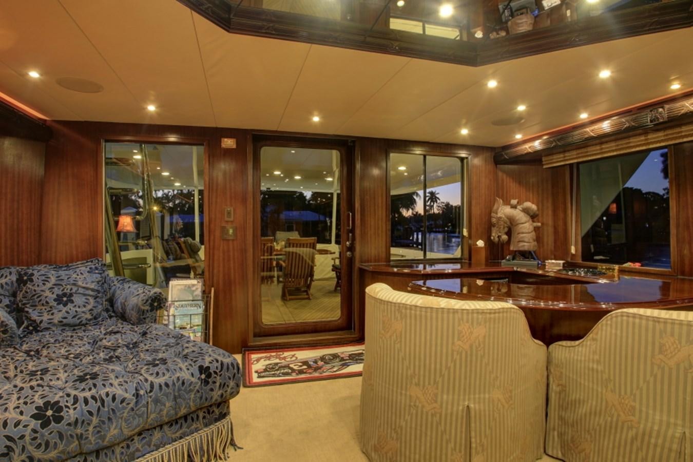 a large living room with a large table and chairs aboard SUNDAY MONEY Yacht for Sale