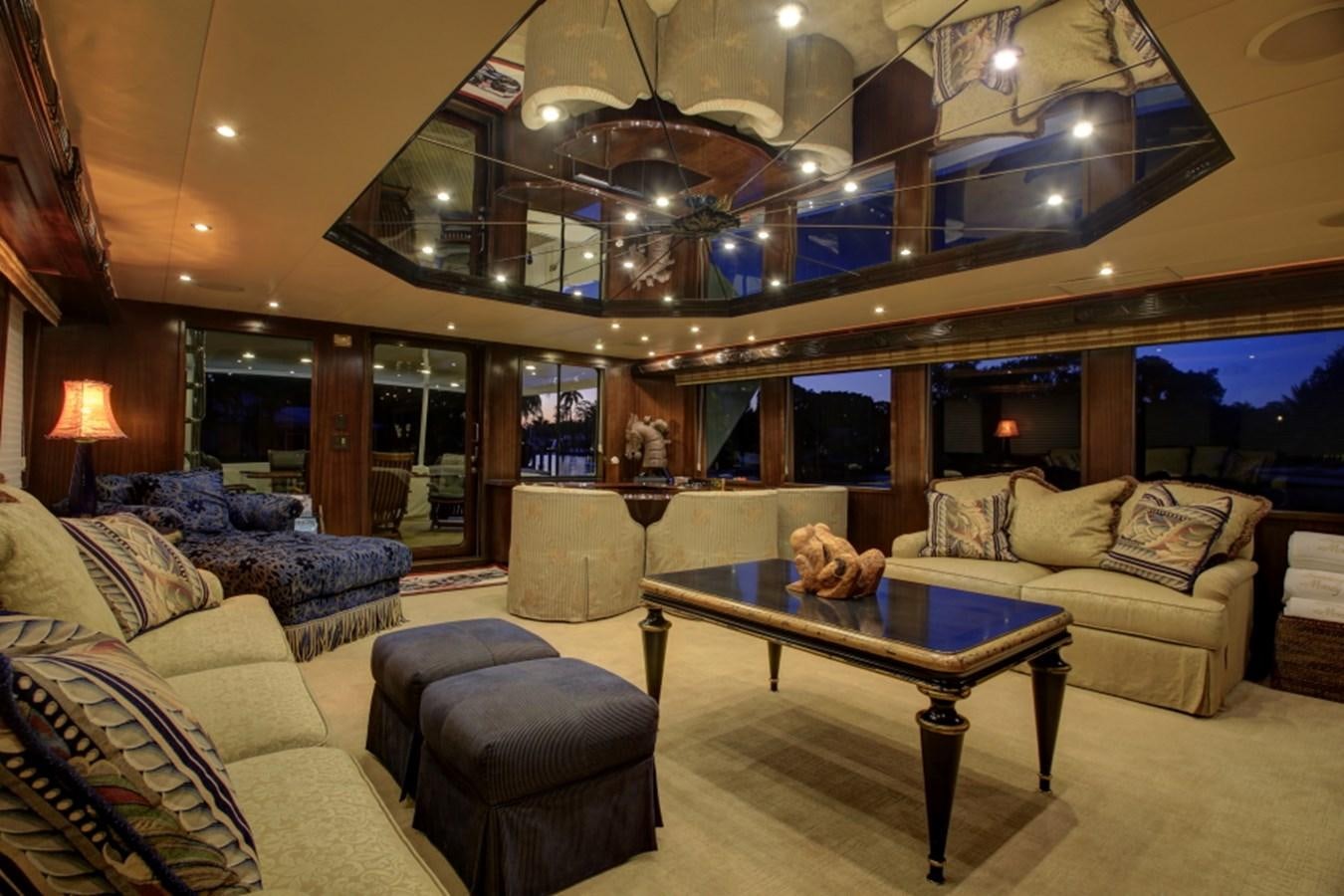 a living room with a large chandelier aboard SUNDAY MONEY Yacht for Sale