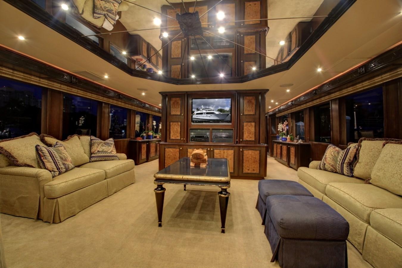 a living room with a fireplace aboard SUNDAY MONEY Yacht for Sale