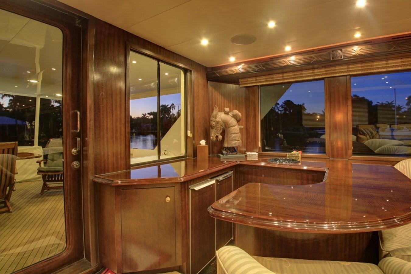 a room with a table and chairs aboard SUNDAY MONEY Yacht for Sale