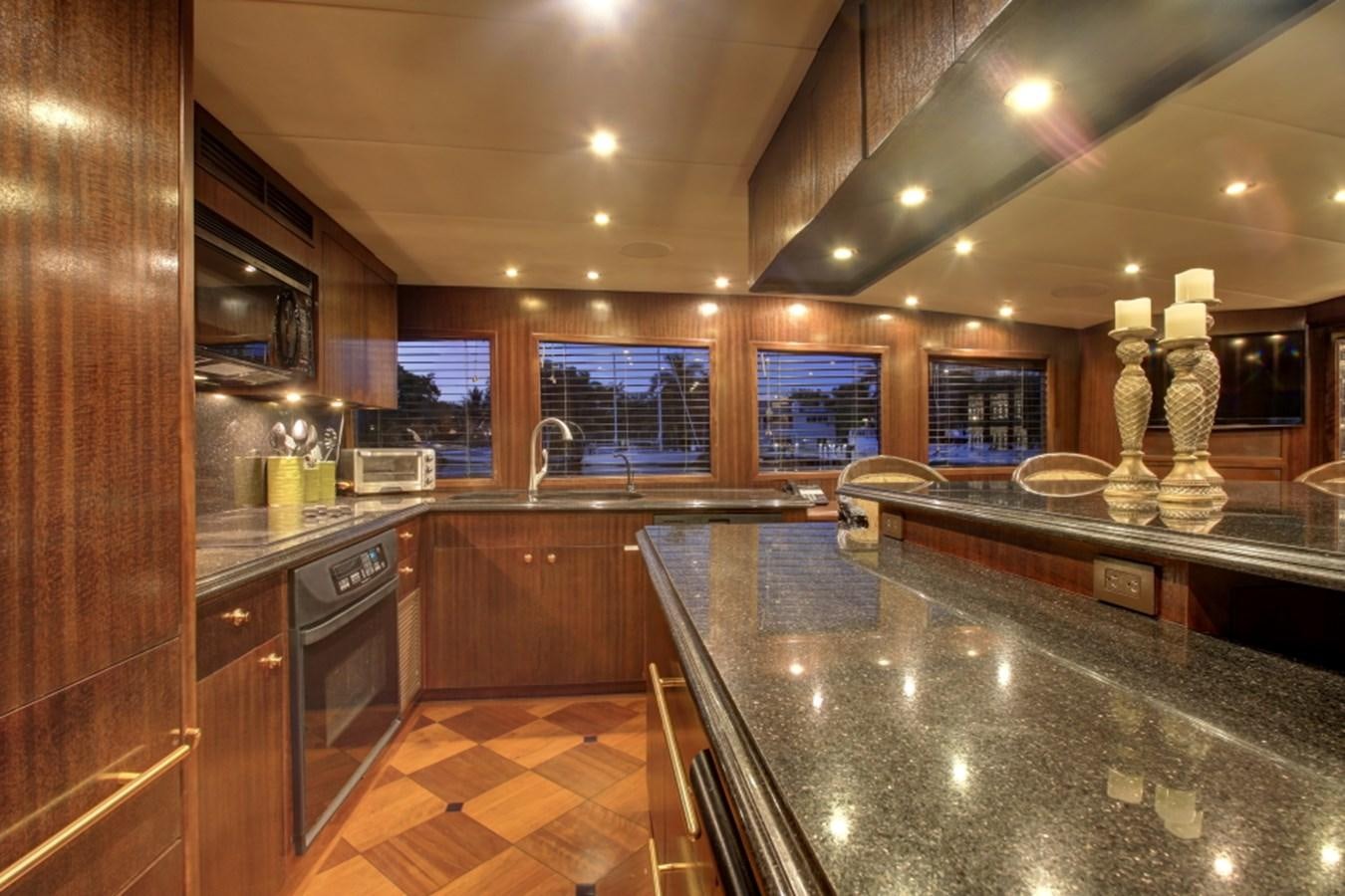 a kitchen with a marble counter top aboard SUNDAY MONEY Yacht for Sale