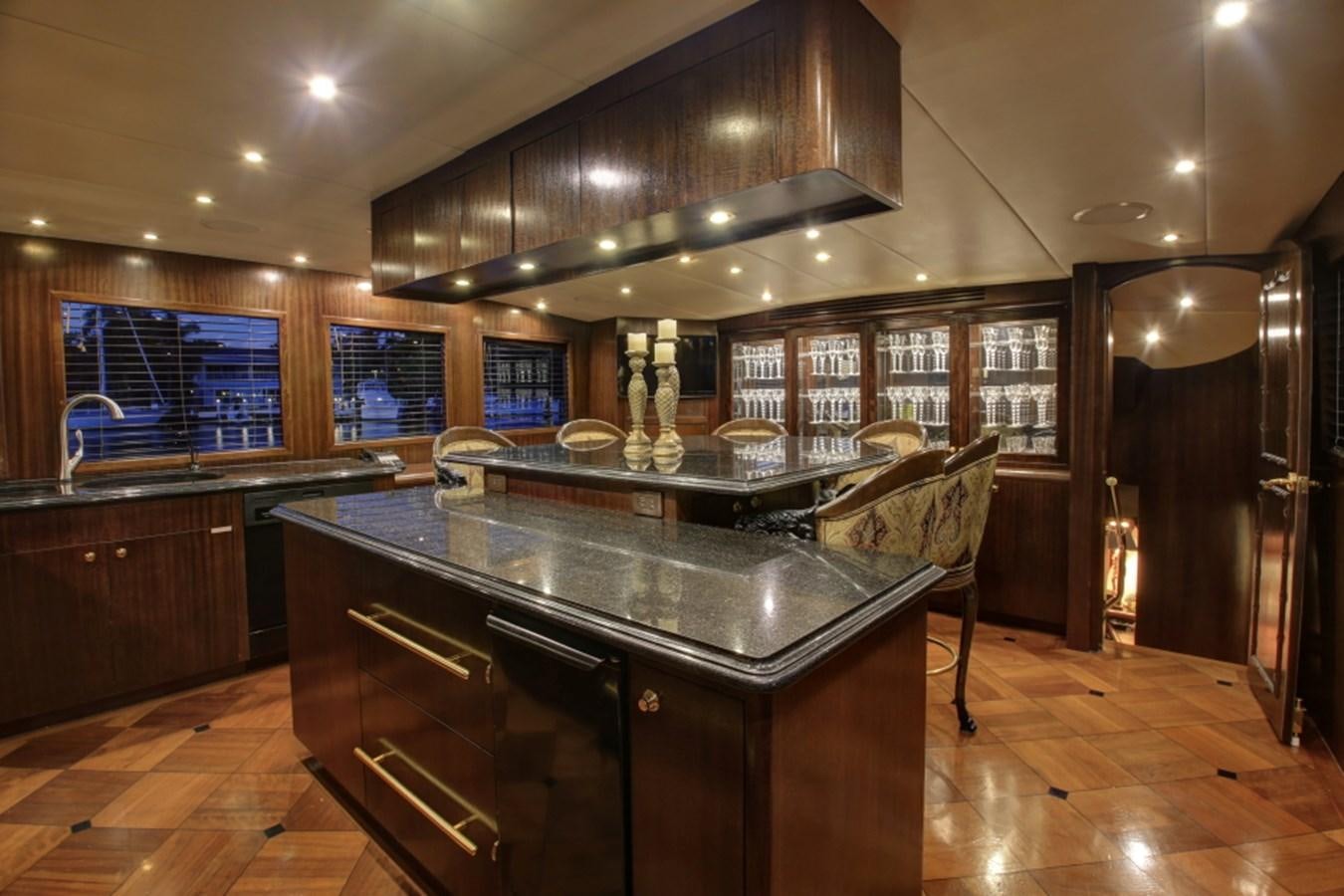 a kitchen with a bar and a bar aboard SUNDAY MONEY Yacht for Sale