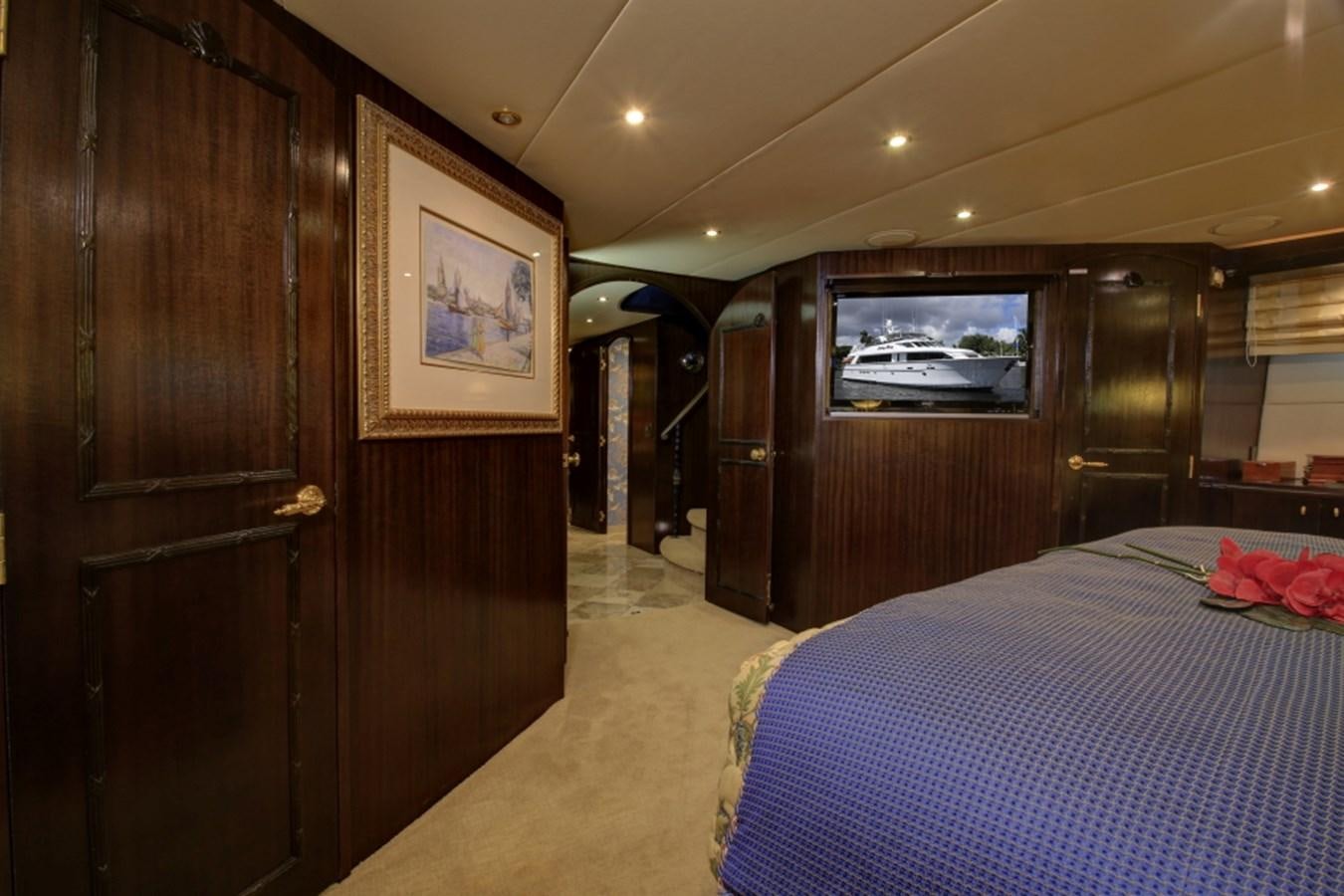 a bedroom with a bed and a closet aboard SUNDAY MONEY Yacht for Sale