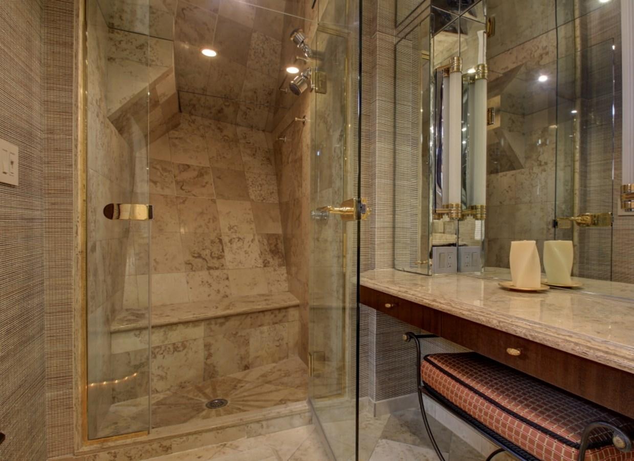 a bathroom with a countertop sink and a mirror aboard SUNDAY MONEY Yacht for Sale