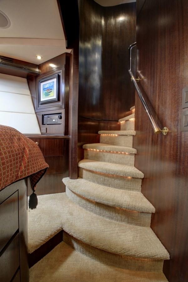 a staircase with a red rug aboard SUNDAY MONEY Yacht for Sale