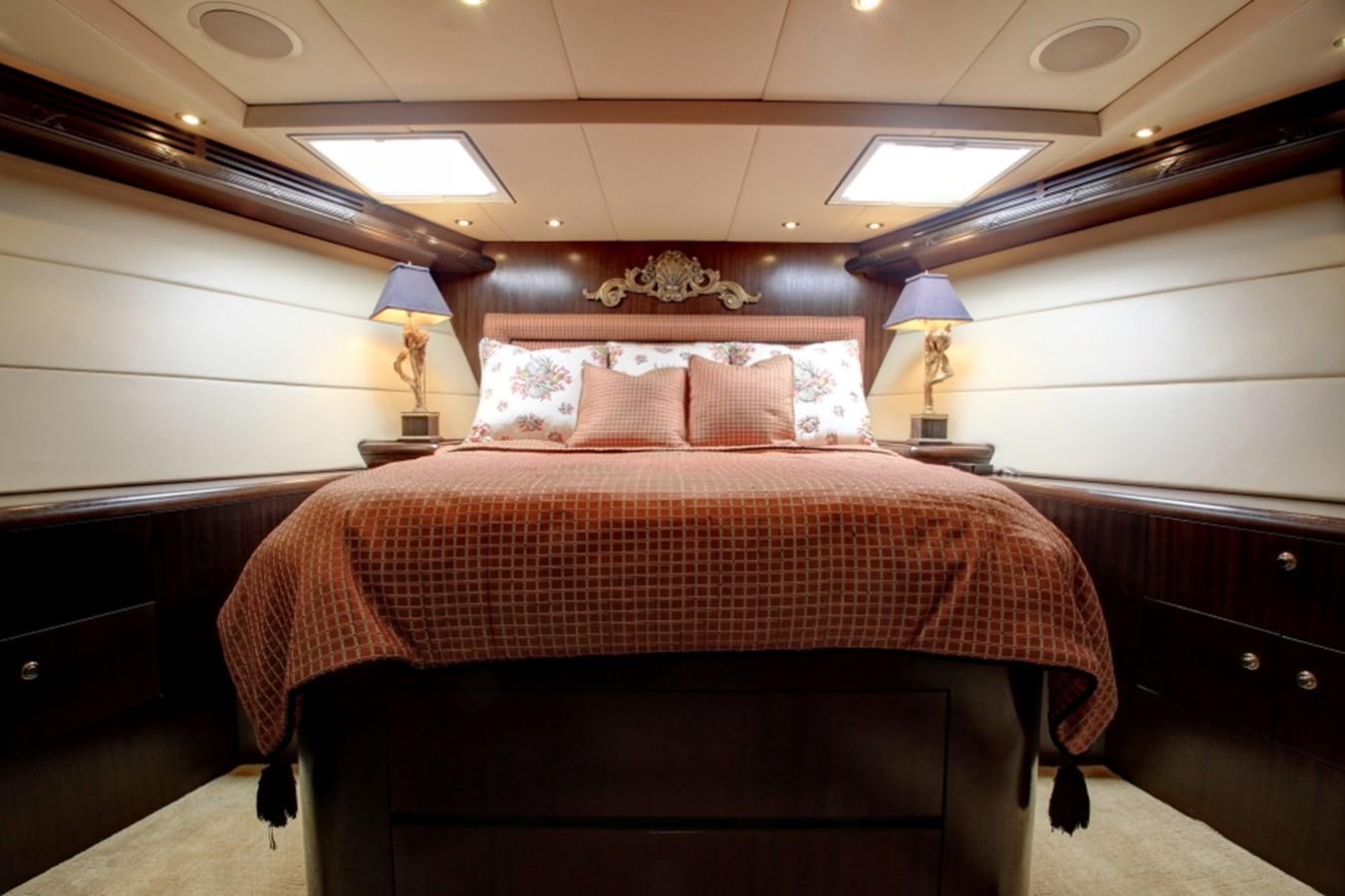 a bed with a brown comforter aboard SUNDAY MONEY Yacht for Sale
