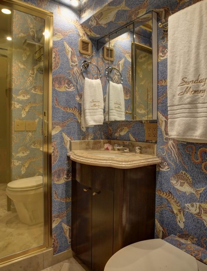 a bathroom with a sink and toilet aboard SUNDAY MONEY Yacht for Sale