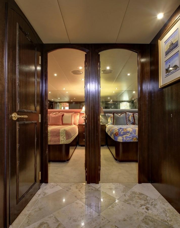 a room with a mirror and couch aboard SUNDAY MONEY Yacht for Sale
