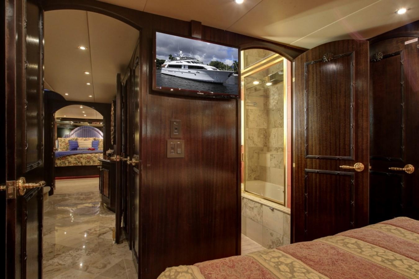a bedroom with a wood door aboard SUNDAY MONEY Yacht for Sale