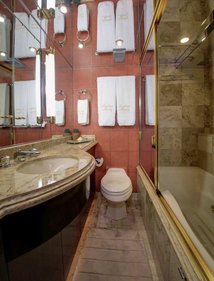 a bathroom with a sink toilet and bathtub aboard SUNDAY MONEY Yacht for Sale