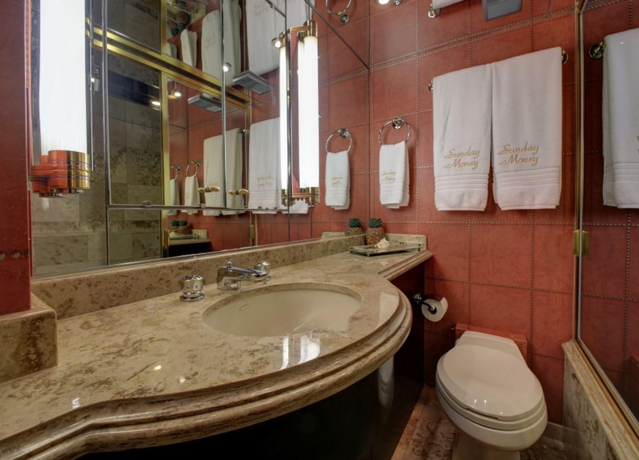 a bathroom with a sink and toilet aboard SUNDAY MONEY Yacht for Sale