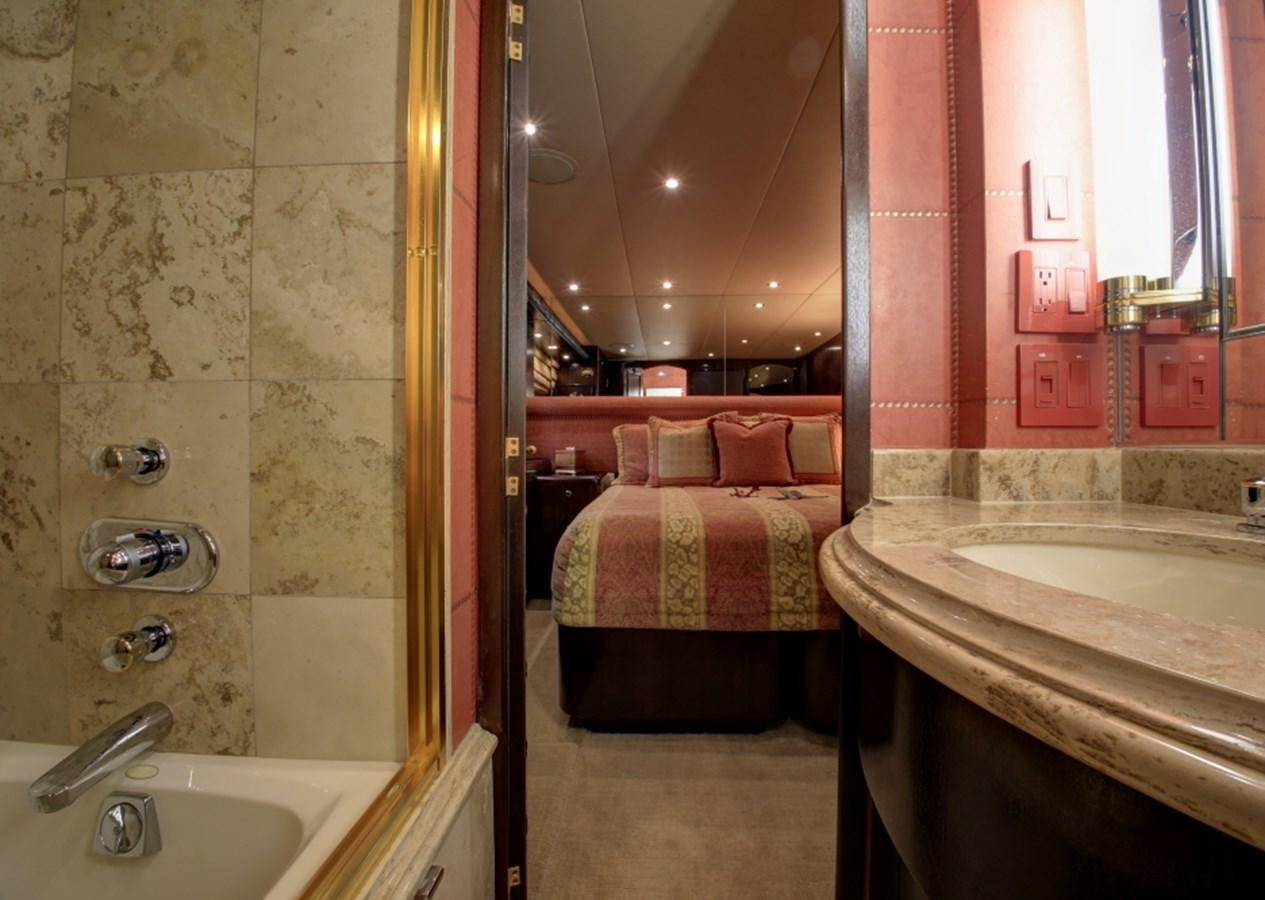 a bathroom with a sink and a bed aboard SUNDAY MONEY Yacht for Sale