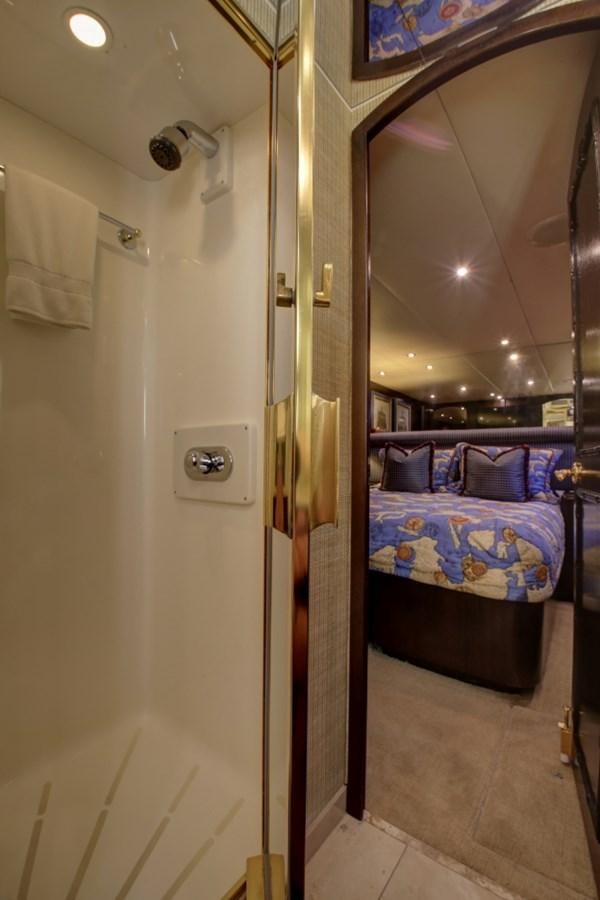 a bathroom with a bed and a mirror aboard SUNDAY MONEY Yacht for Sale