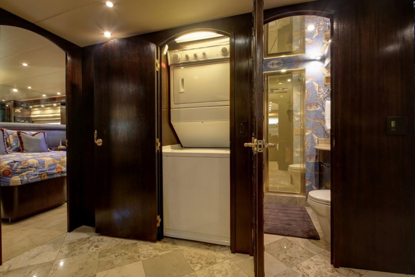 a room with a bed and a door aboard SUNDAY MONEY Yacht for Sale