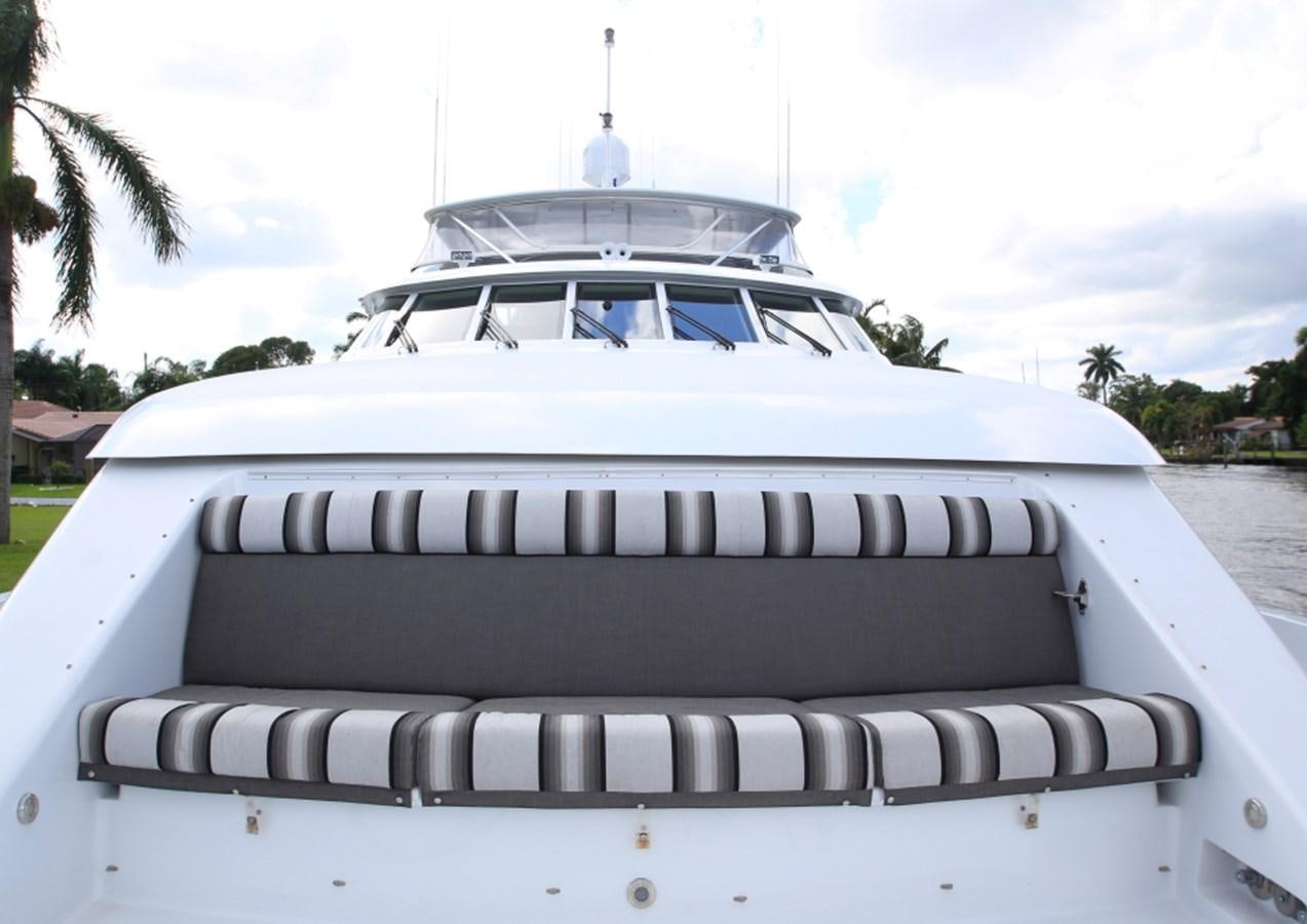 a white car with a black and white stripe on the front aboard SUNDAY MONEY Yacht for Sale