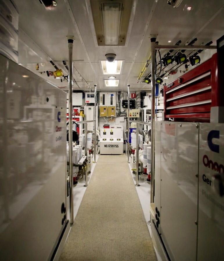 a hallway with doors and lights aboard SUNDAY MONEY Yacht for Sale