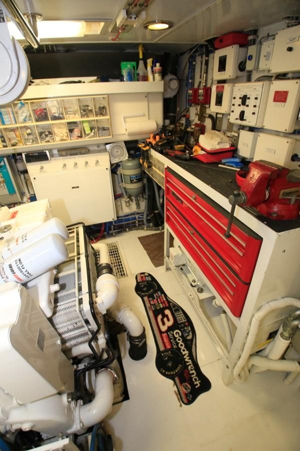 a room with a machine and a desk with a computer aboard SUNDAY MONEY Yacht for Sale