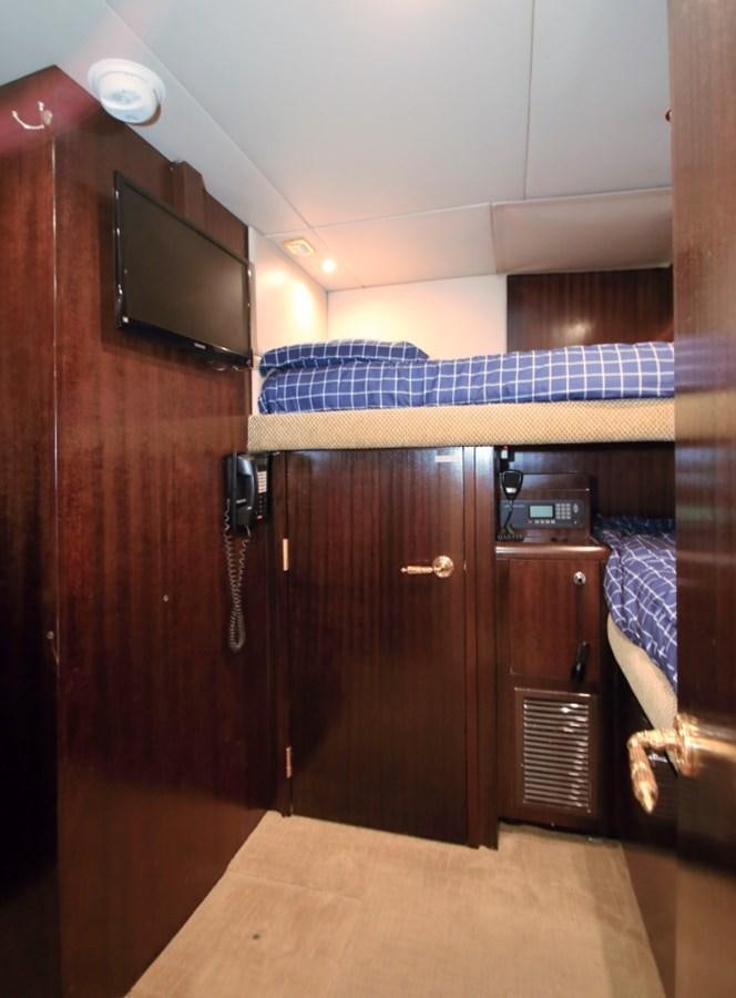 a room with a tv and a bed aboard SUNDAY MONEY Yacht for Sale